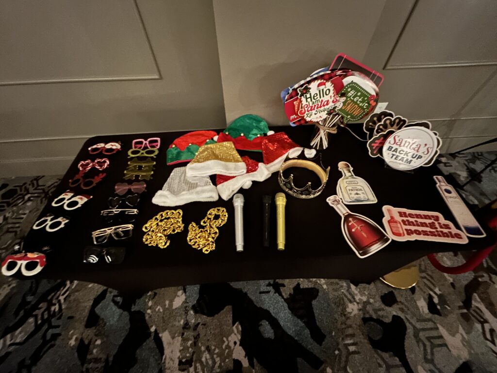 Jump King event prop table with glasses, signs and photo booth accessories
